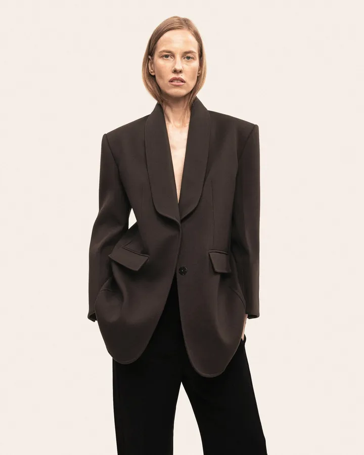 The finished shawl-collar jacket, worn